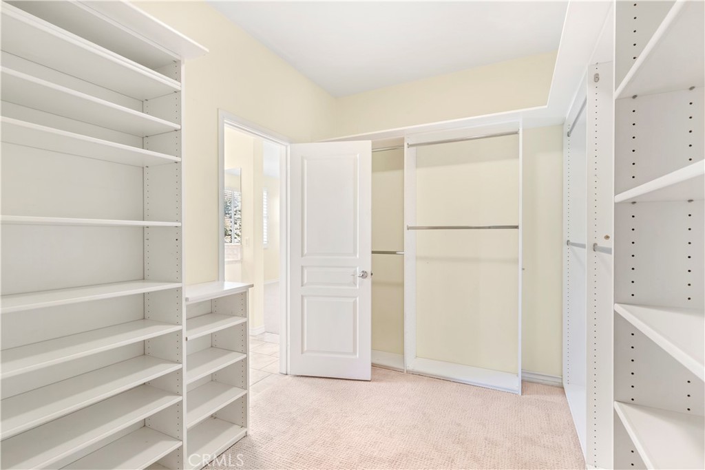 87 Fringe Tree Irvine, CA 92606 - Photo 16 of 24 Primary Walk-In Closet w/Built-ins