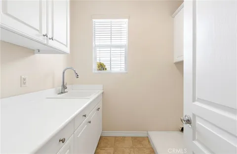 a bathroom with a sink and a window
