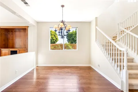 a view of an entryway with wooden floor