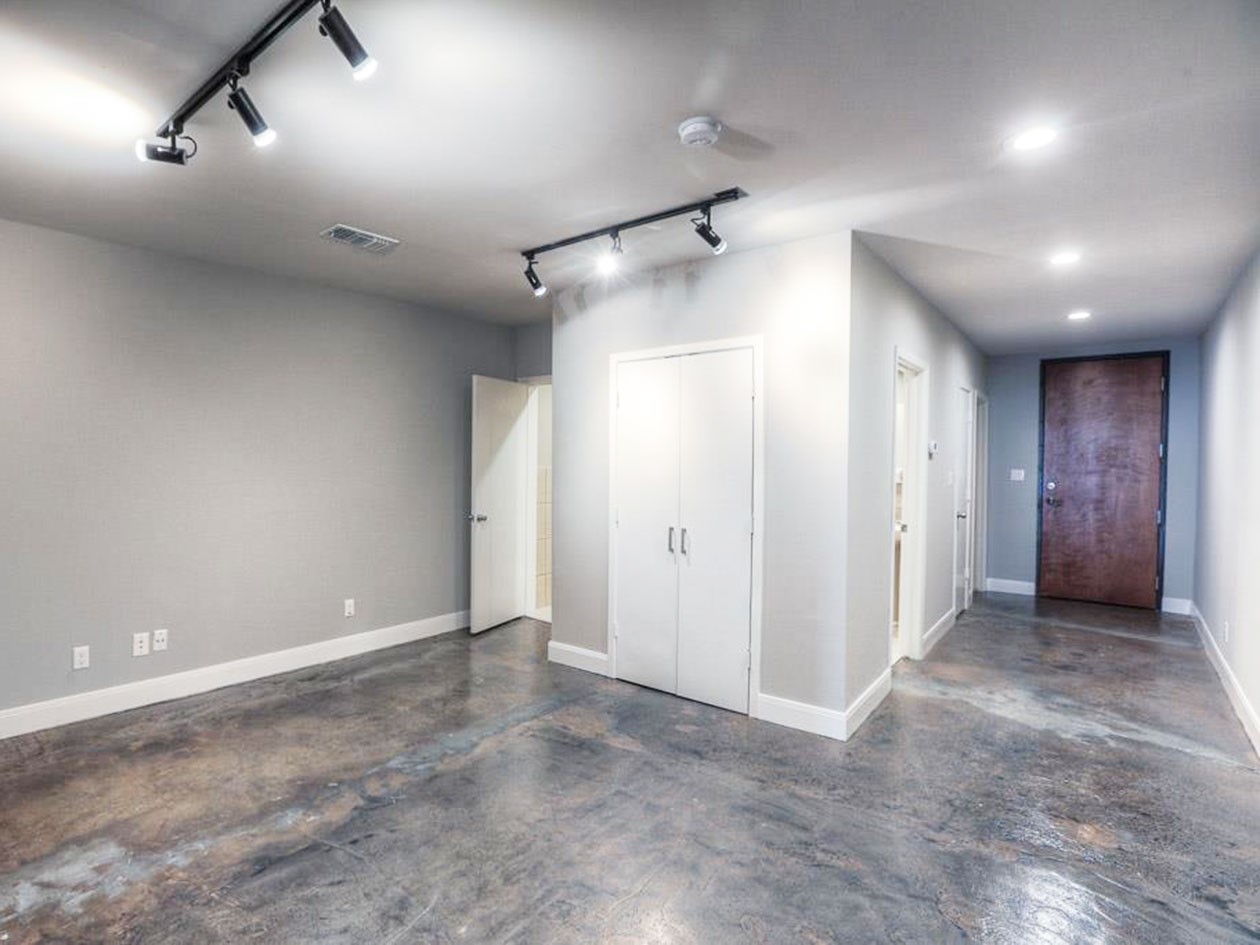 1601 West Webster Street, Unit 11 Houston, TX 77019 - Photo 11 of 26 an empty room with closet and windows