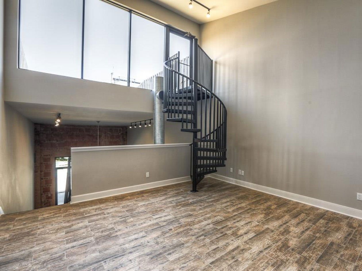 1601 West Webster Street, Unit 11 Houston, TX 77019 - Photo 14 of 26 a view of an empty room with stairs