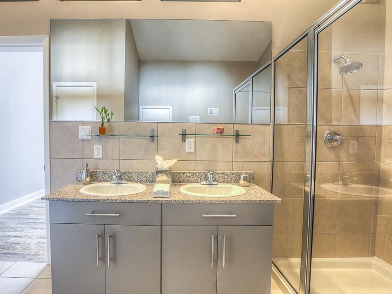 1601 West Webster Street, Unit 11 Houston, TX 77019 - Photo 19 of 26 a bathroom with a sink and a mirror