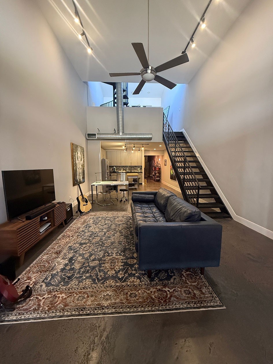 1601 West Webster Street, Unit 11 Houston, TX 77019 - Photo 24 of 26 a living room with furniture and a flat screen tv