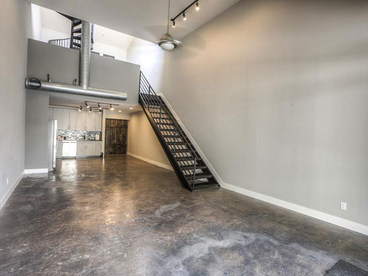 1601 West Webster Street, Unit 11 Houston, TX 77019 - Photo 4 of 26 a view of an empty room with stairs