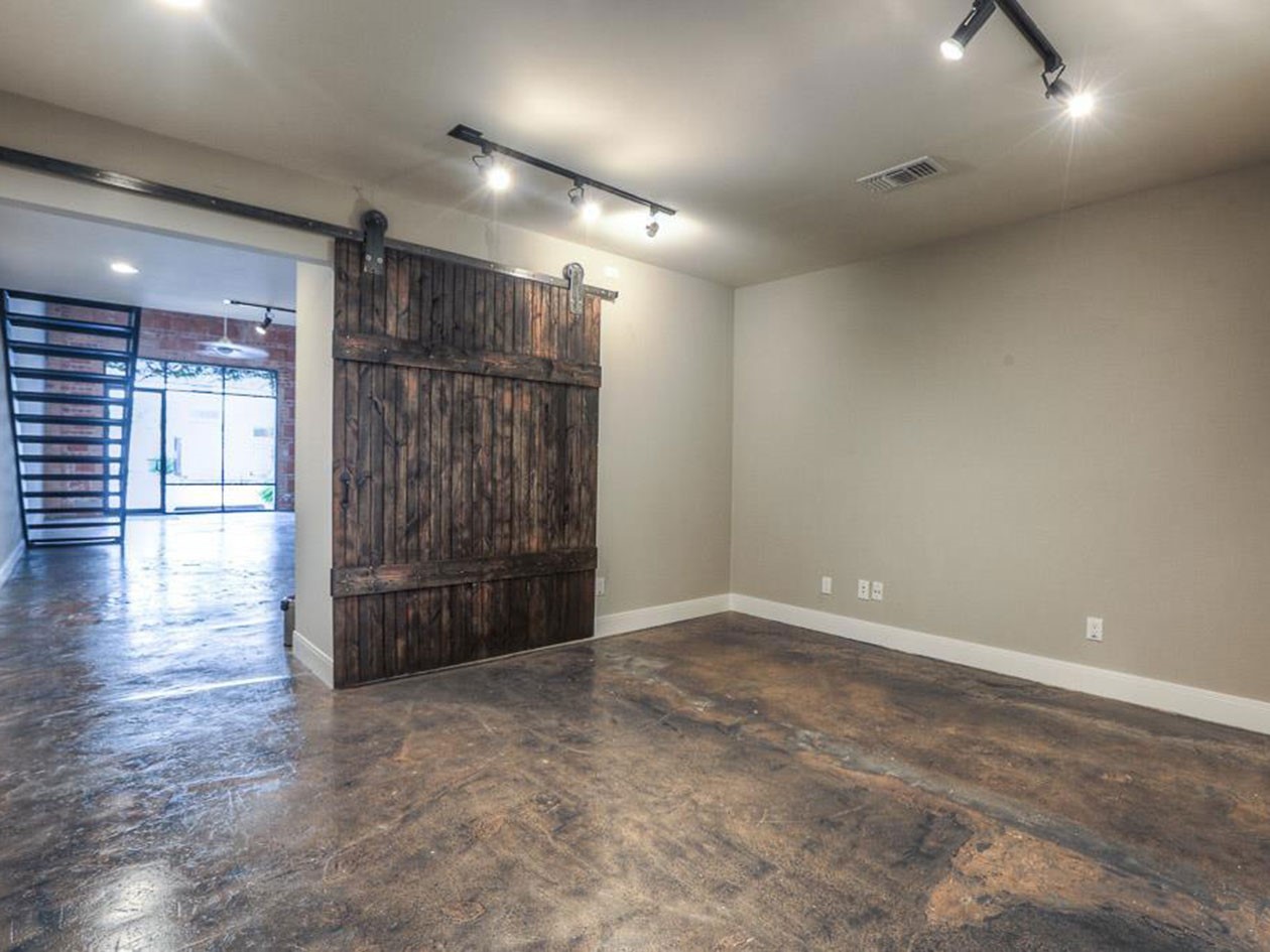 1601 West Webster Street, Unit 11 Houston, TX 77019 - Photo 5 of 26 an empty room with wooden floor and entrance