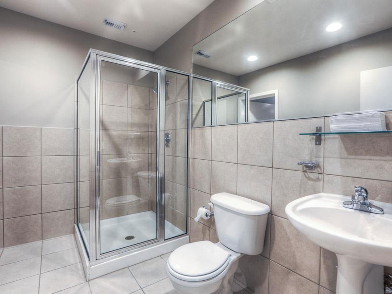 1601 West Webster Street, Unit 11 Houston, TX 77019 - Photo 7 of 26 a bathroom with a sink toilet and shower