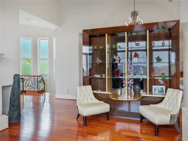a dining room with furniture and chandelier