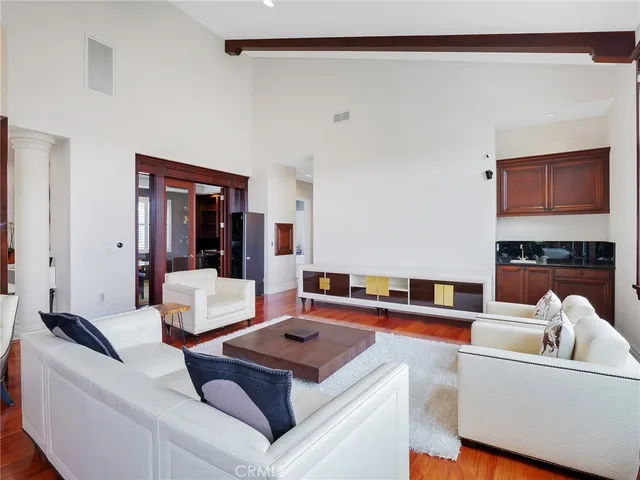 a bed room with a bed and a mirror