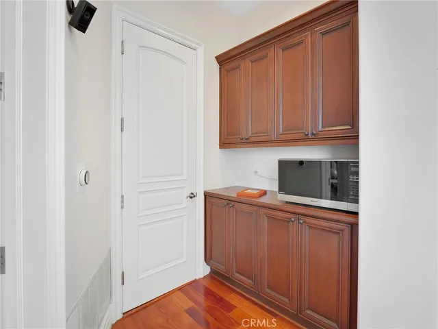 a white toilet sitting next to a window