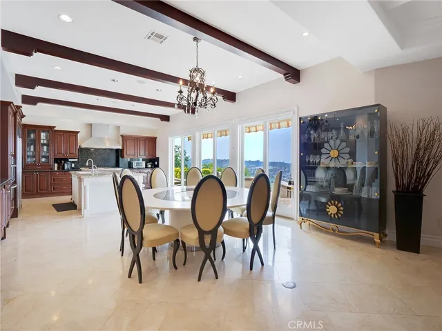 a bedroom with furniture and a large window