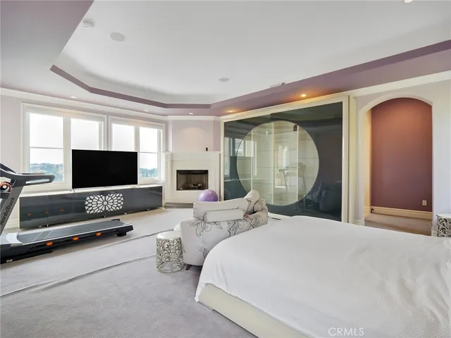 a bathroom with a granite countertop sink toilet a large mirror a bathtub and shower