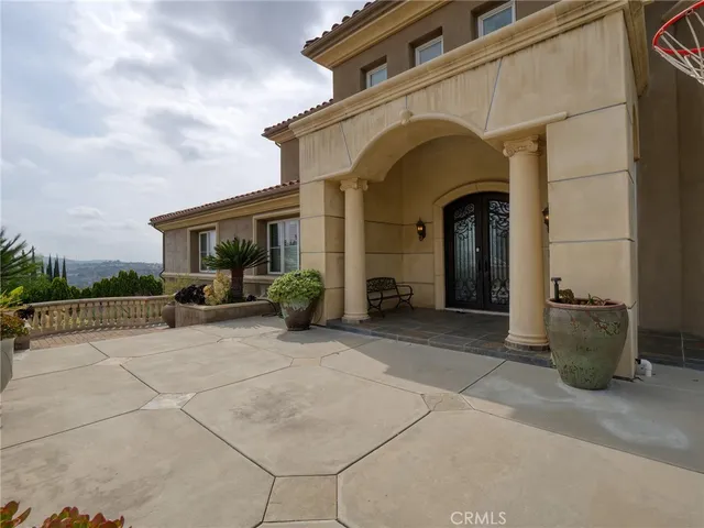 an outdoor space with furniture and city view