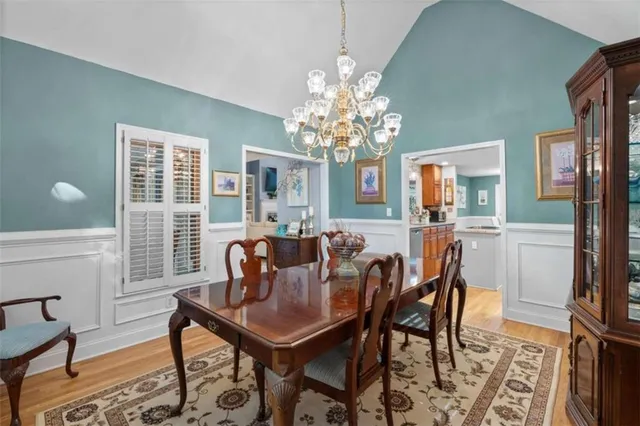 a view of a dining room with furniture and window