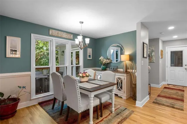 a view of a dining room with furniture window and wooden floor
