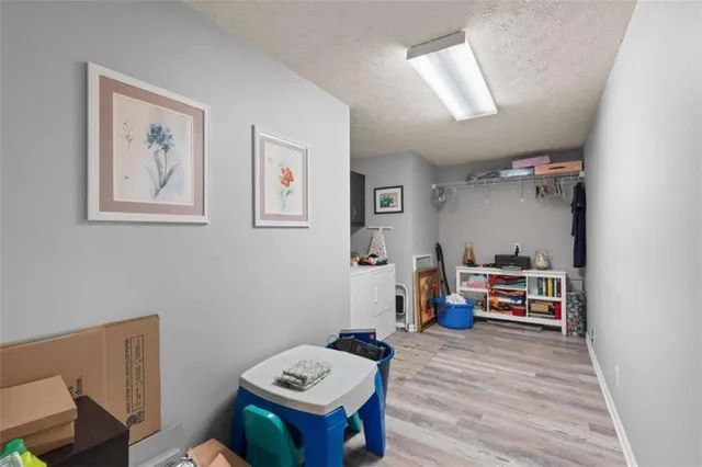 a bedroom with furniture and a wooden floor