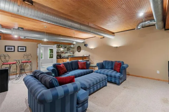 a living room with furniture and a projector