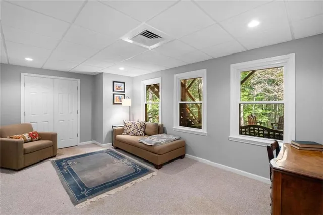 a bedroom with furniture and a window