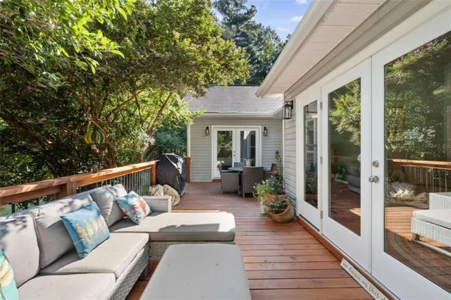 a balcony with furniture and wooden floor