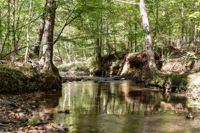 a view of water with a building in the background
