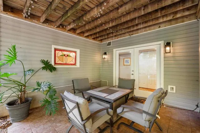 a outdoor space with a couch and a potted plant