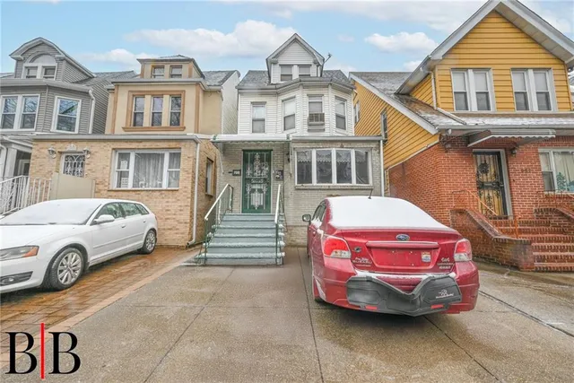 a front view of a house with parking