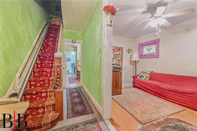 a living room with furniture and a rug