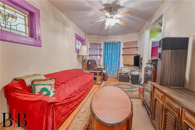 a bedroom with furniture and a chandelier