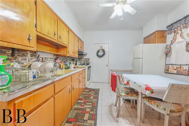 a kitchen with stainless steel appliances kitchen island granite countertop a sink and cabinets