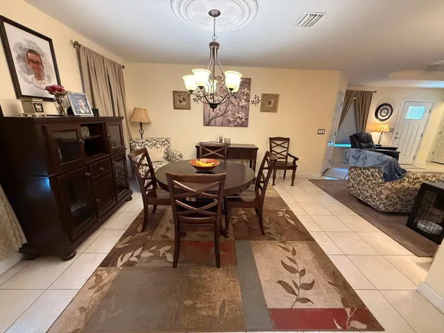a kitchen with granite countertop a refrigerator and a stove