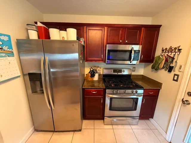 a kitchen with a sink cabinets and window