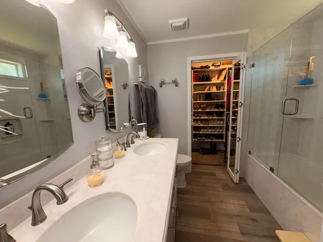 a bathroom with a bathtub and a shower