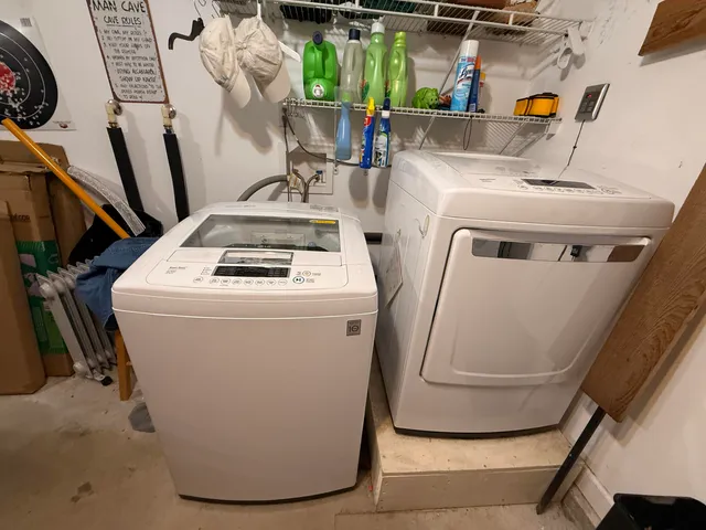 a view of a house with swimming pool and a yard