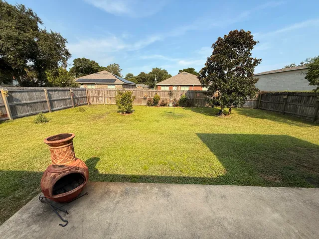 a view of a swimming pool with a garden