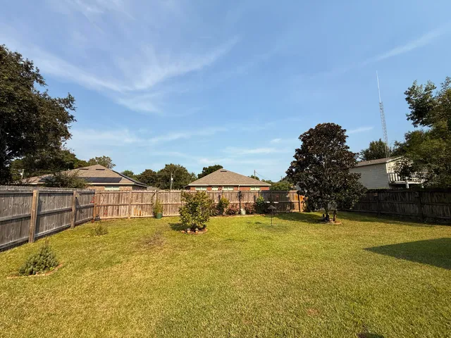 a bathroom with a toilet and a mirror