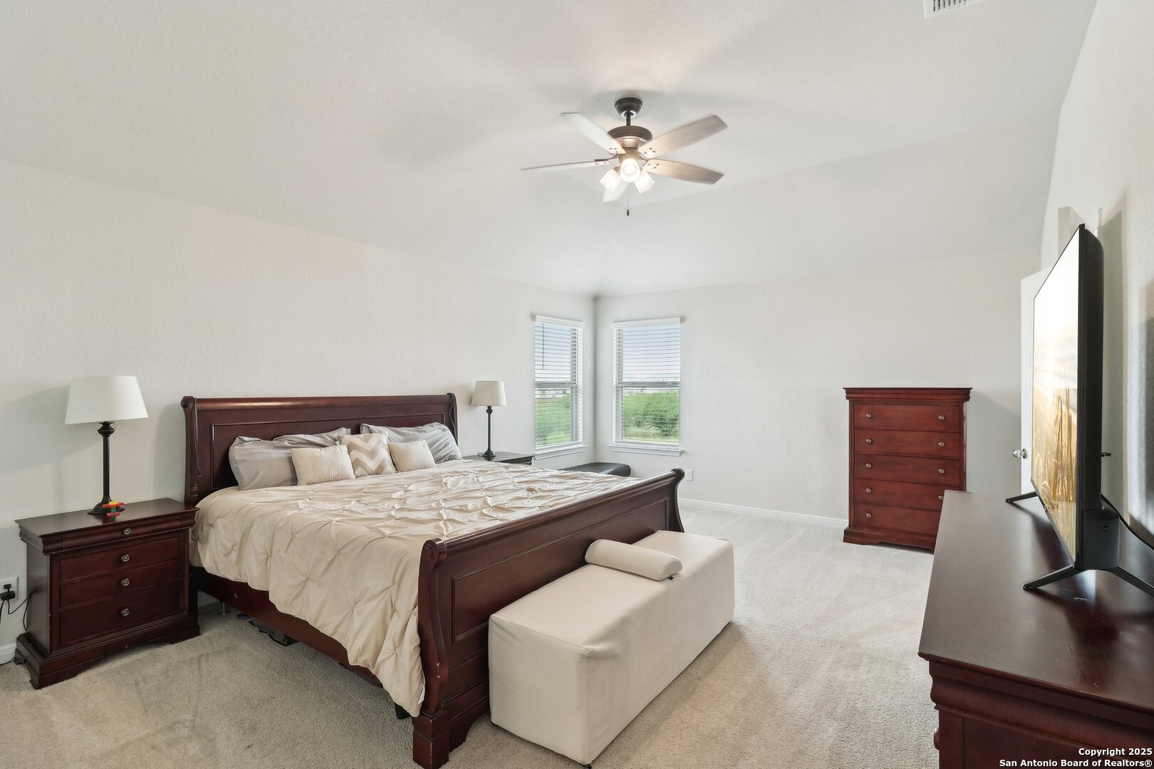 402 Devnet Cibolo, TX 78108 - Photo 21 of 32 a bedroom with a bed and a flat screen tv
