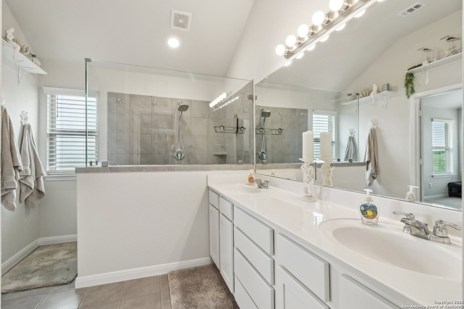 402 Devnet Cibolo, TX 78108 - Photo 26 of 32 a bathroom with double vanity and a mirror