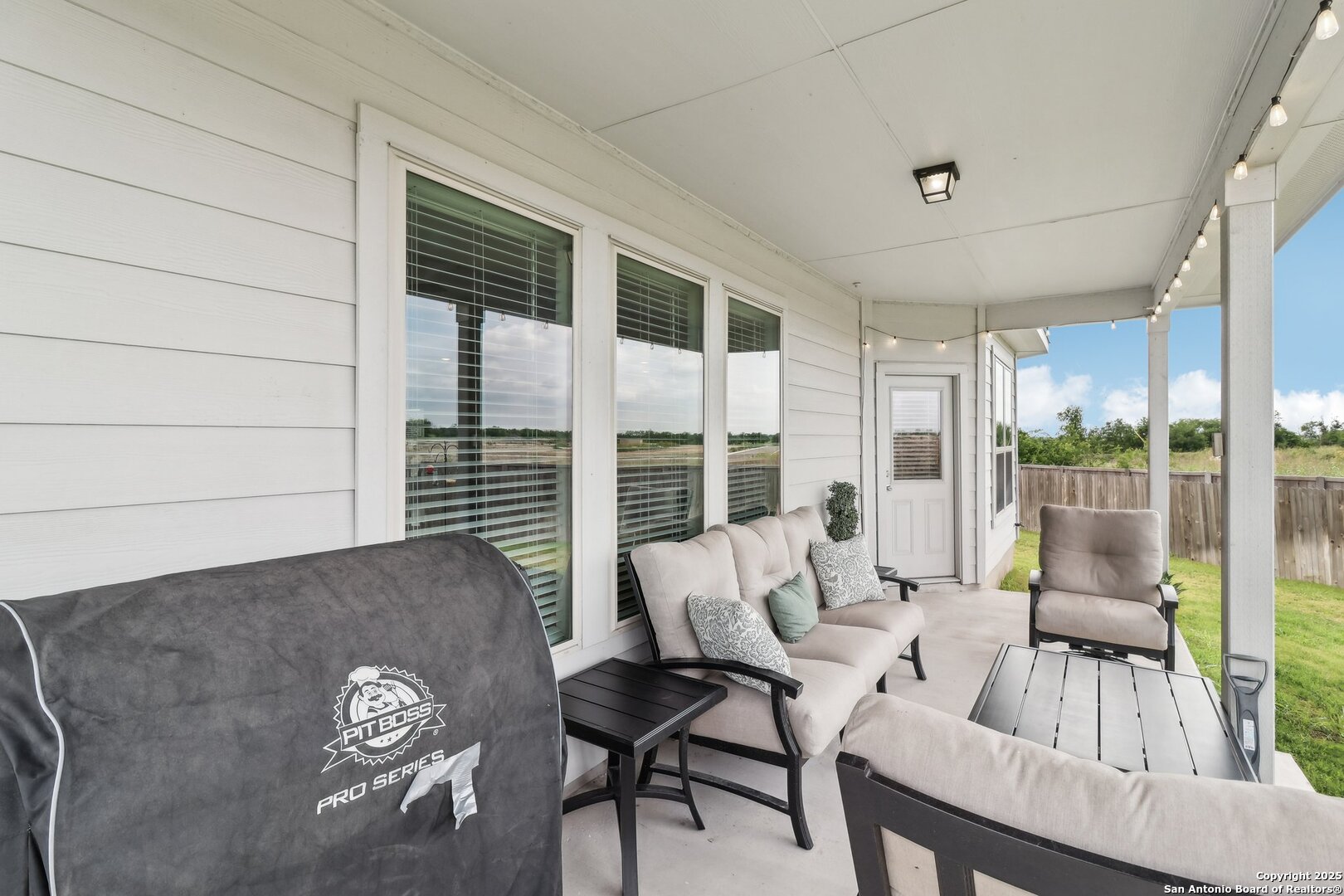 402 Devnet Cibolo, TX 78108 - Photo 27 of 32 a living room with furniture and a large window