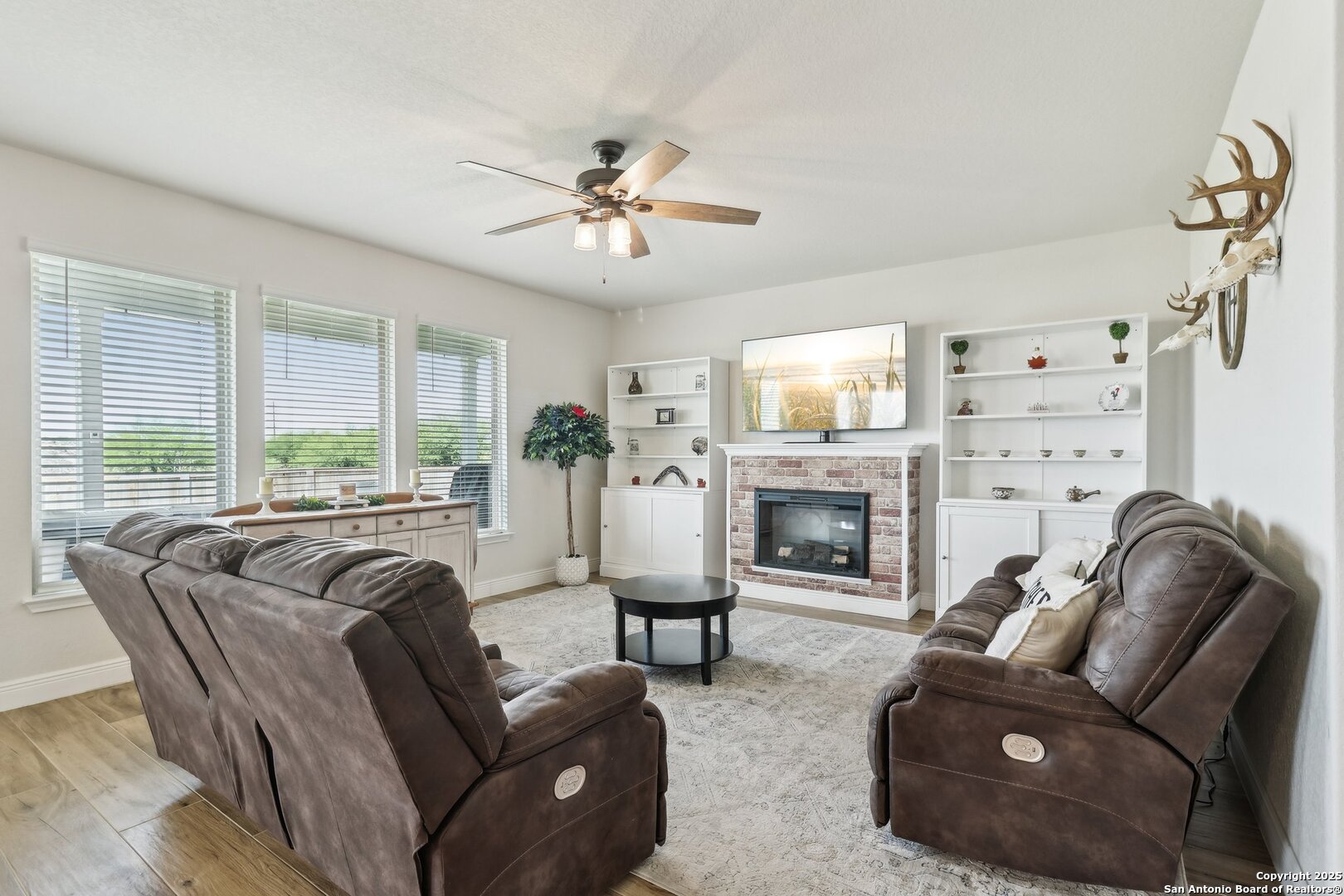 402 Devnet Cibolo, TX 78108 - Photo 4 of 32 a living room with furniture fireplace and a large window