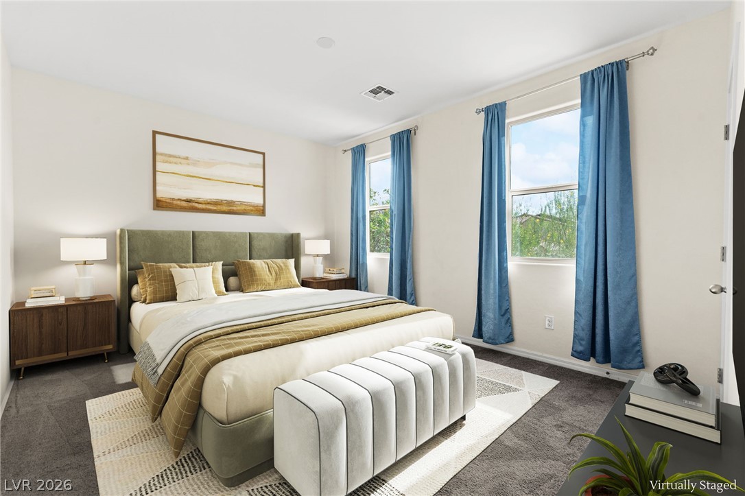 11048 Prairie Grove Road Las Vegas, NV 89179 - Photo 55 of 75 A restful bedroom offers soft carpet underfoot, with a serene view through multiple windows.