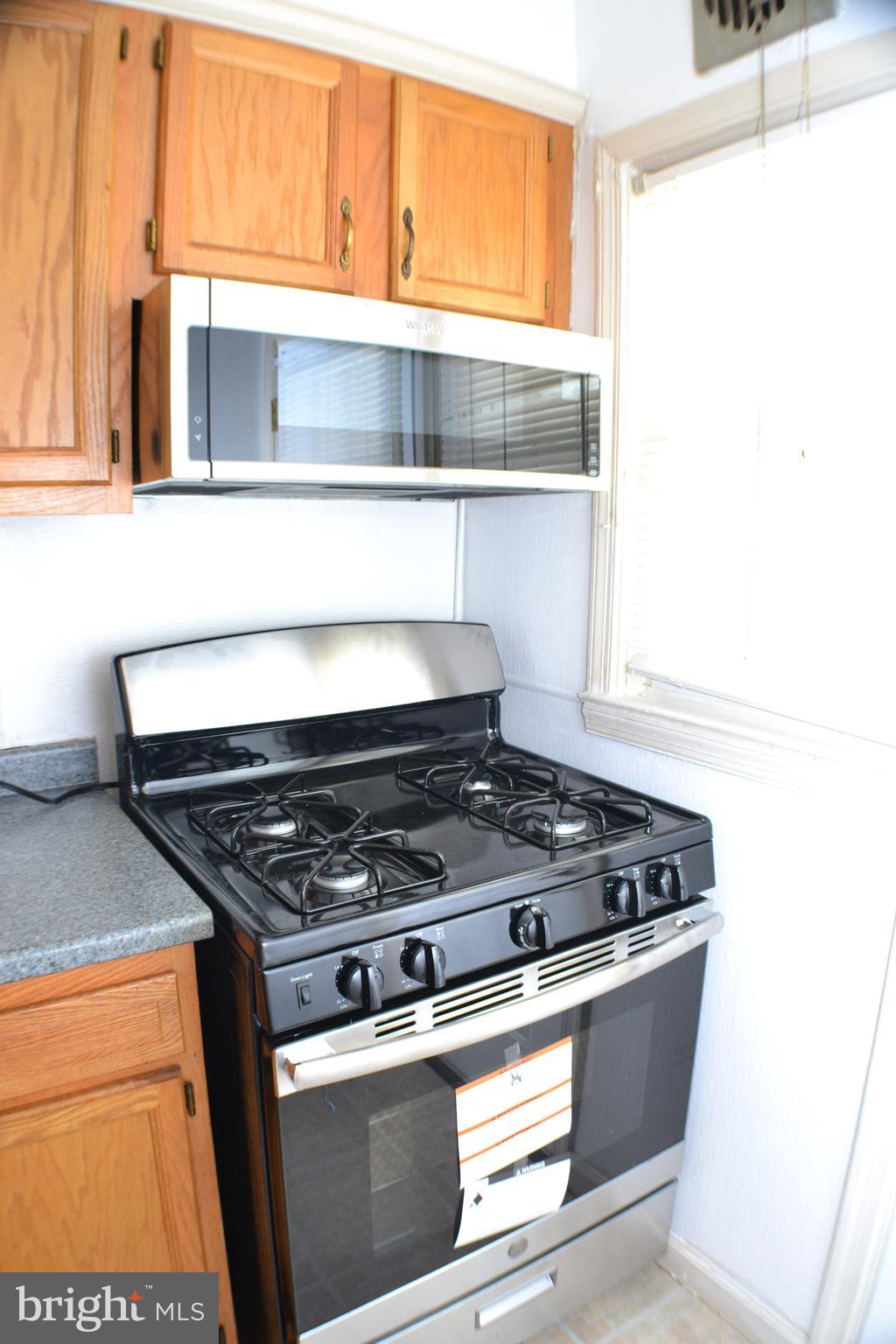 202 Kingston Road Middle River, MD 21220 - Photo 8 of 21 a stove top oven sitting inside of a kitchen