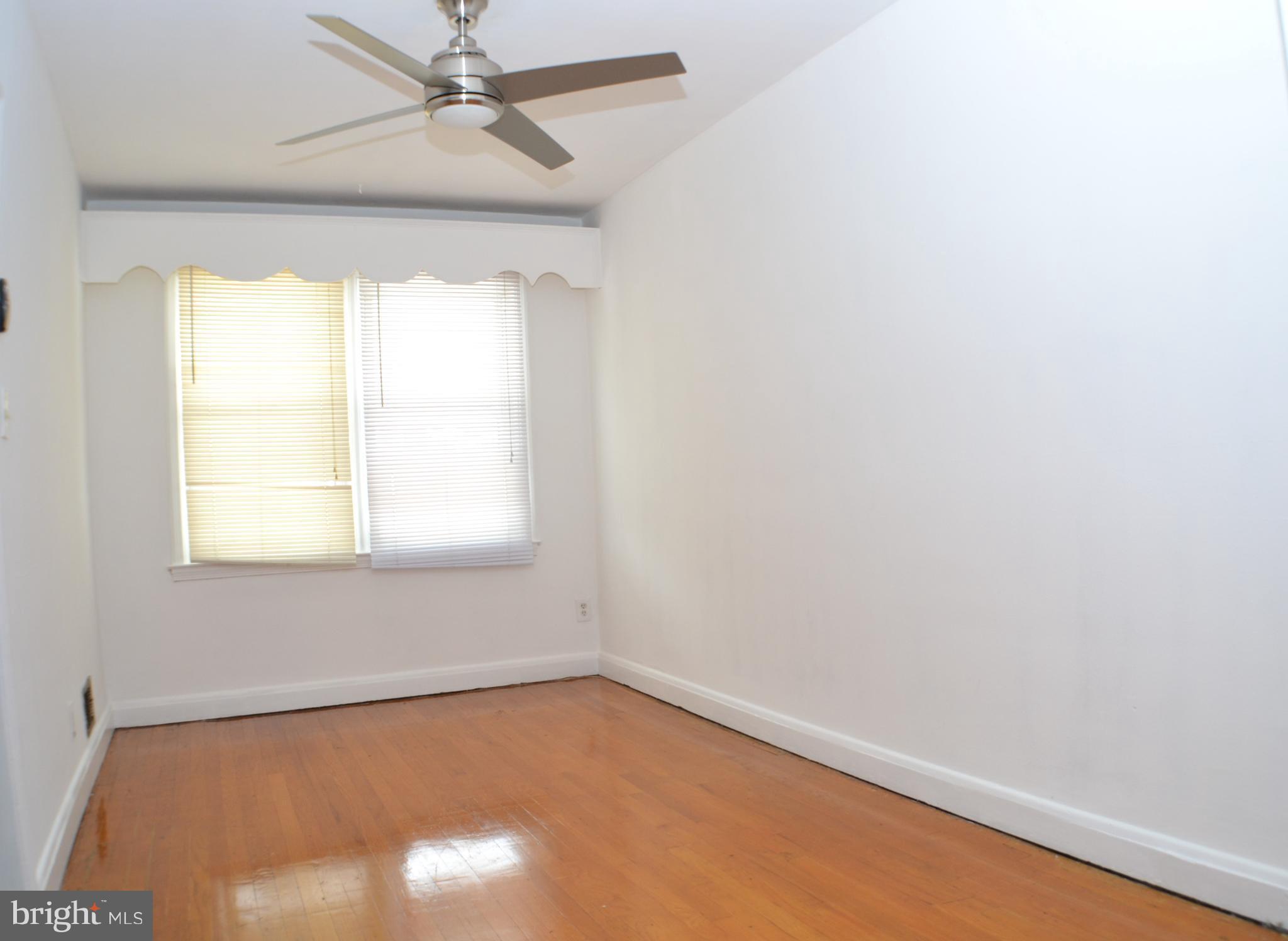 202 Kingston Road Middle River, MD 21220 - Photo 9 of 21 an empty room with a window and a fan