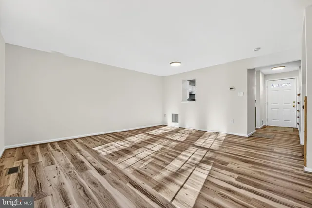 a view of a bedroom with wooden floor and bedroom