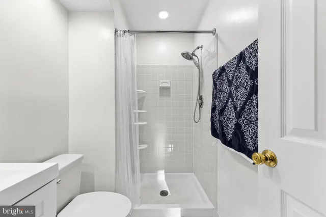 a bathroom with a toilet and shower