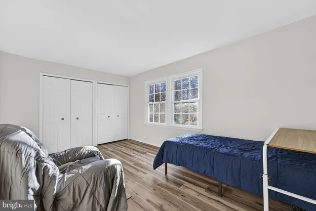 a bedroom with a bed and a closet