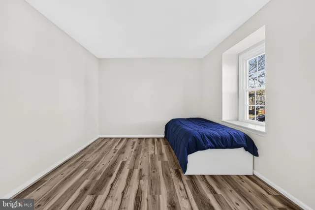 a room with a bed and a window