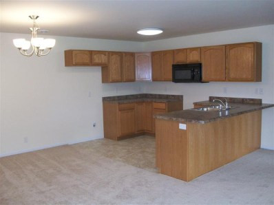 361 A South Boo Road Burns Harbor, IN 46304 - Photo 3 of 10 a kitchen with stainless steel appliances granite countertop a sink a stove top oven a counter space and cabinets