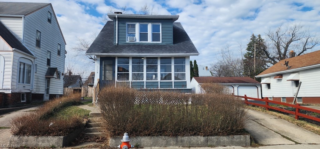 1514 Clermont Road Cleveland, OH 44110 - Photo 15 of 16 Bungalow with a shingled roof, a detached garage, a sunroom, and an outdoor structure