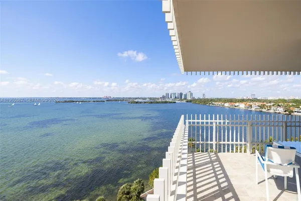 a view of a balcony with wooden floor