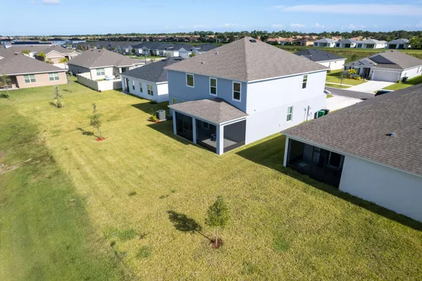 an aerial view of a house with a swimming pool