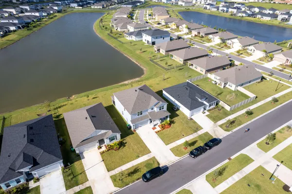 an aerial view of a house with a ocean view